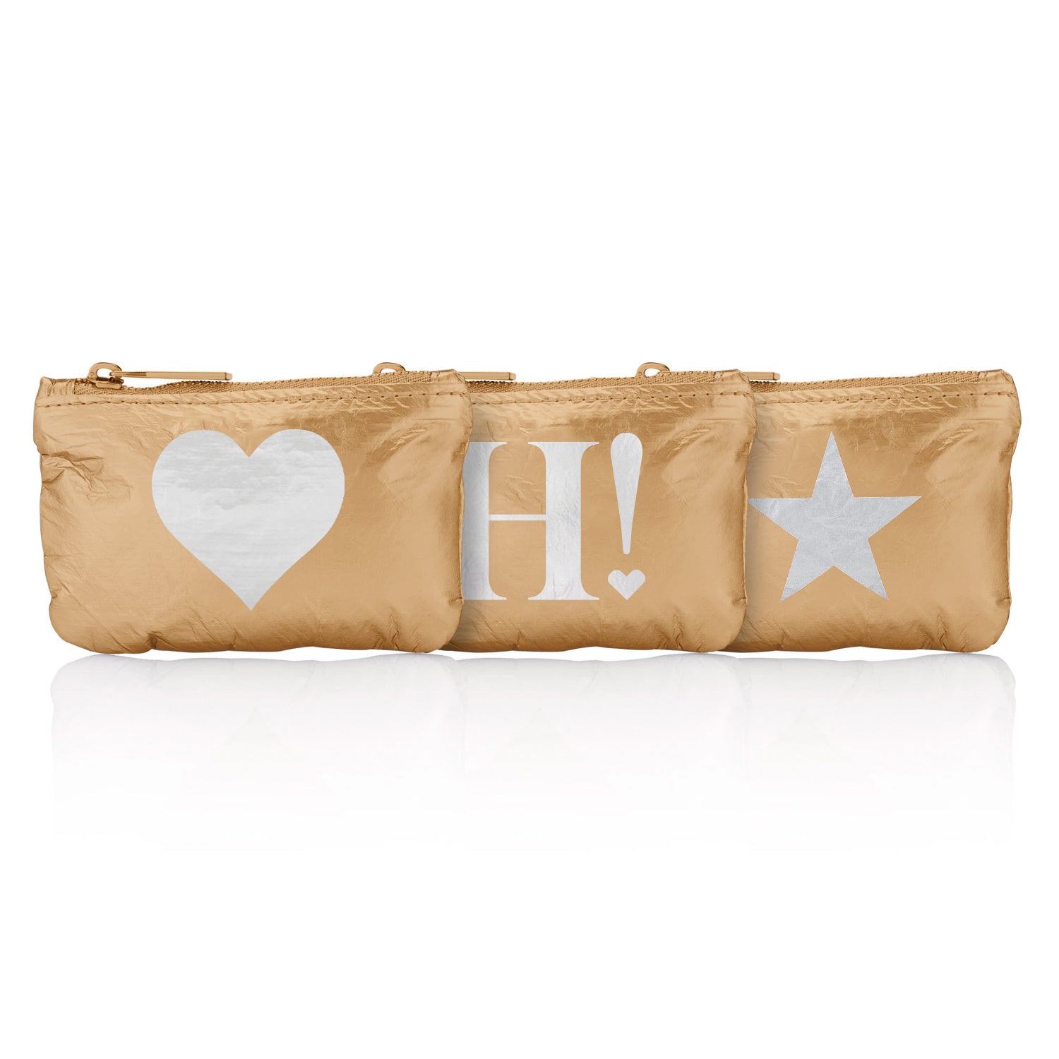 Three small zipper pouches in gold with silver heart, silver H!, and silver star