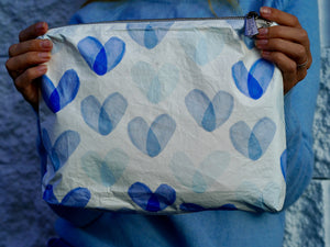 White medium zipper pouch with variety of blue hearts