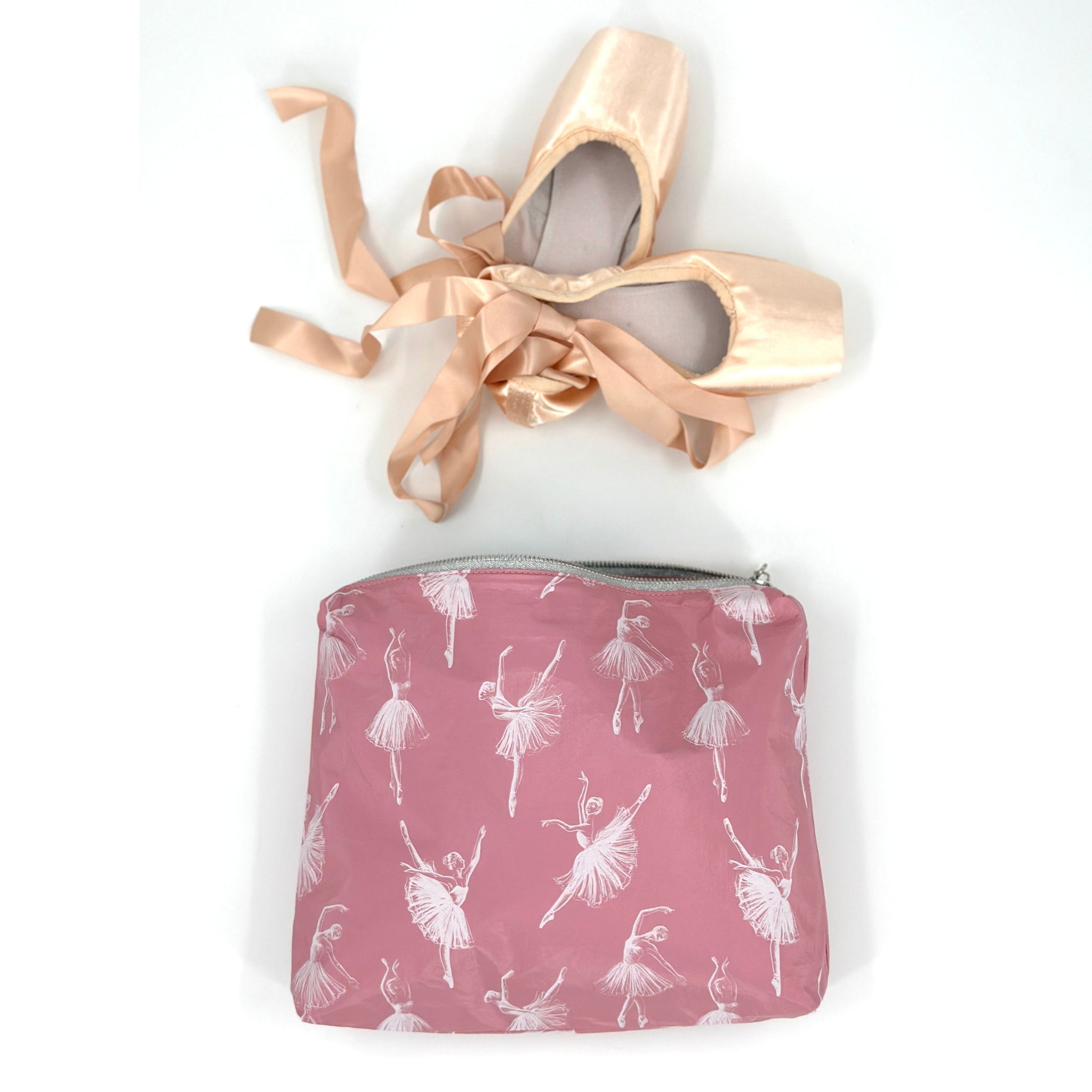 Medium zipper pouch in blush pink dancing ballerinas pattern with ballet shoes inside