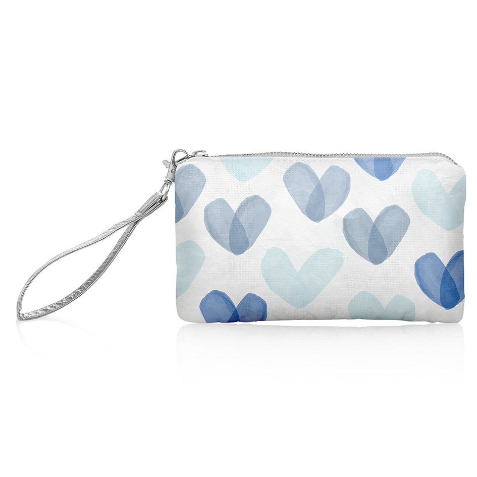 White zip wristlet with shades of blue hearts and silver wrist strap