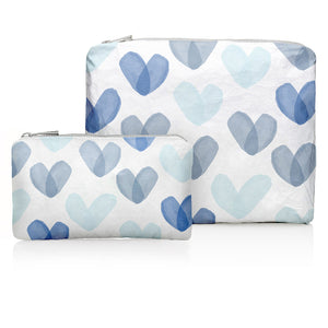 Medium and mini zipper pouches in white with hearts in different shades of blue