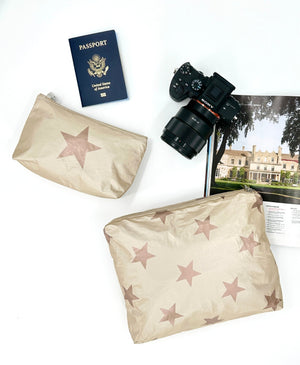 Medium and mini shimmer beige bronze star zipper pouch set with passport, camera, and magazine