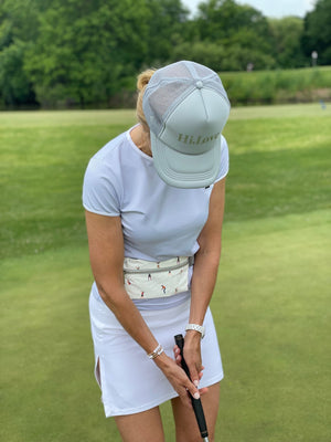 golfing wearing fanny pack